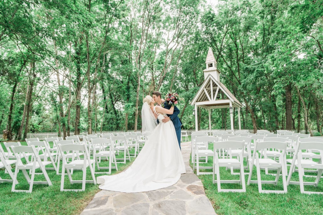 Bride and Groom kissing outside the Reserve at Cottonwood Creek