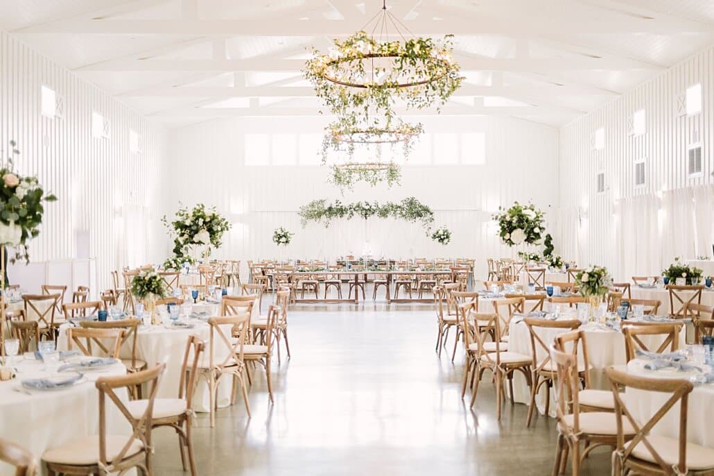 wedding reception at The Farmhouse with greenery centerpieces