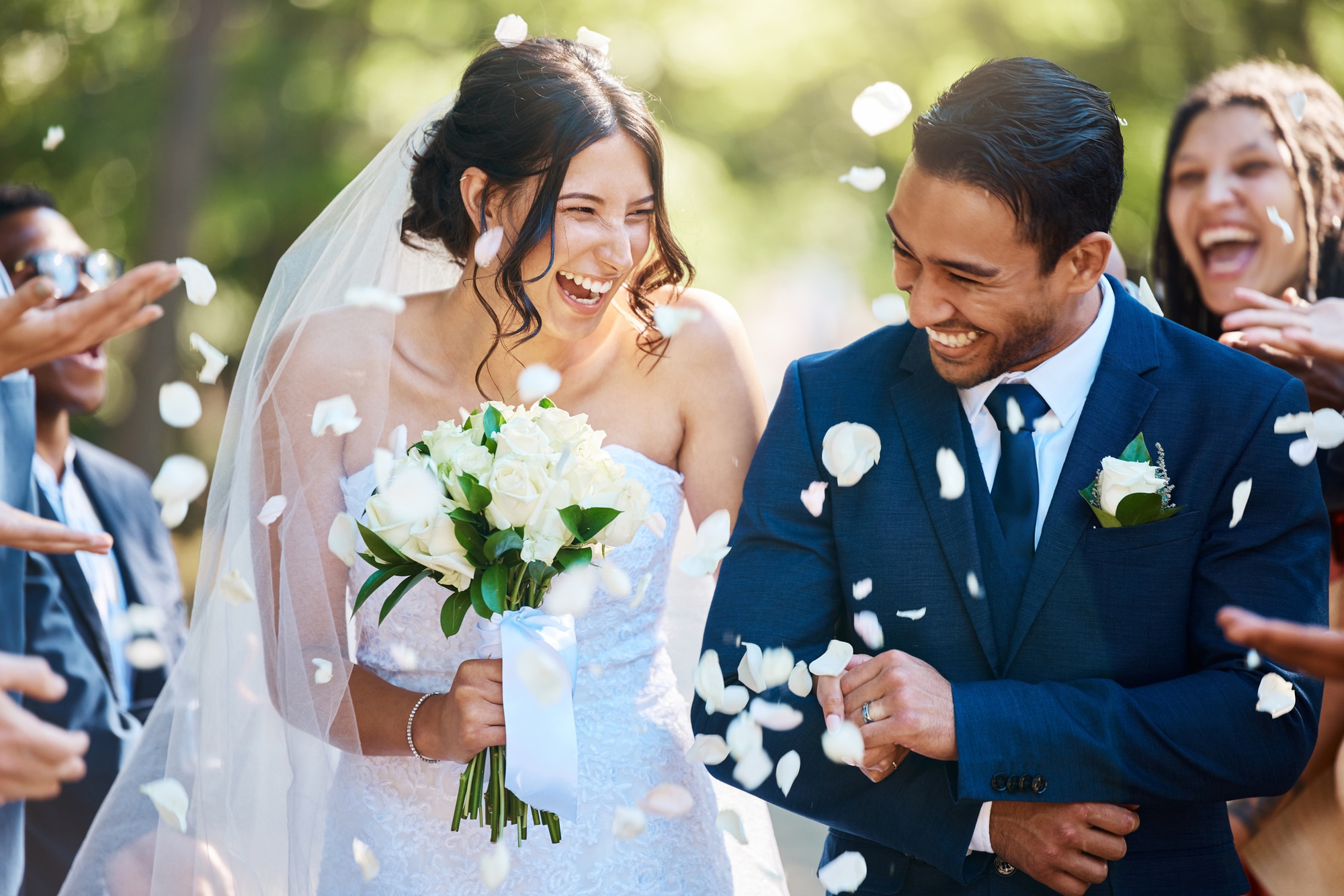 Beautiful bride laughing with her guests at a wedding reception.